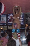 The World Famous *Bob* doing an interpretation of the Abu Ghraib photos.  Some country music singer's interpretation of the Star Spangled Banner played while she stood.  Yes, those are sparklers on either side of her.