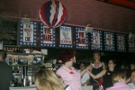 Madge the Manicurist (of the Church Ladies for Choice) dancing with Florent staff, with fabulous signs behind them.