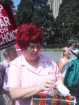 Madge the Manicurist (of the Church Ladies for Choice) passing out Vaginal Pride for Microbicides stickers