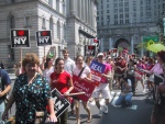 Marchers smiling as they pass the Church Ladies for Choice